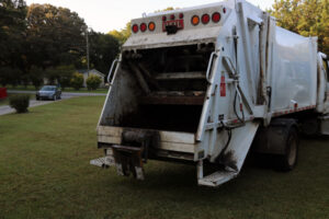 White garbage truck loading end